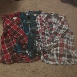 3 large sized button up shirts